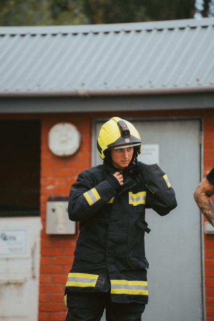 Bow walking wearing a full fire kit 